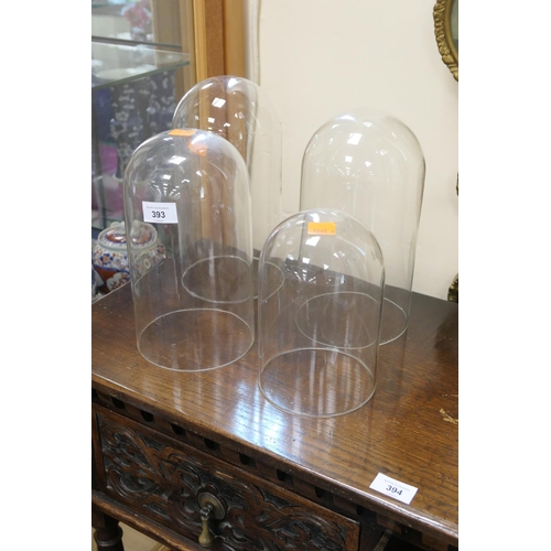 Four glass clock domes, the largest 29cm, the diameters from 13cm 14.5cm