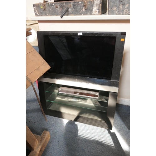 446 - Colour television on integral stand with soundbar and Panasonic DVD player