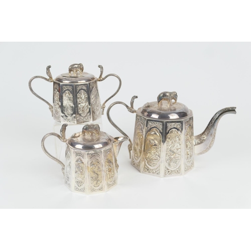 101 - Indian white metal three piece tea service, circa 1900, comprising a lidded teapot with elephant fin... 