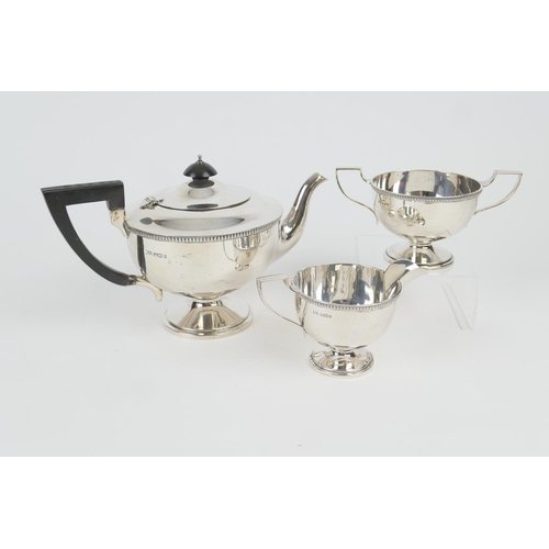 104 - George V silver three piece tea service by Walker & Hall, Sheffield 1932/33, comprising footed U-sha... 