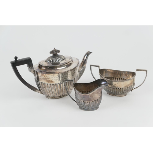 113 - Composite silver three piece tea service, comprising a Victorian silver presentation teapot, London ... 