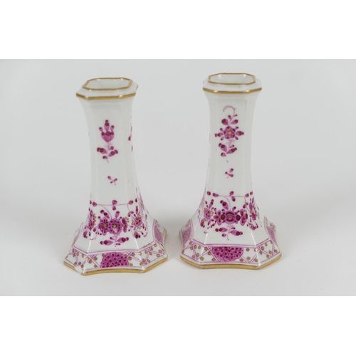 39 - Pair of Meissen porcelain dwarf candlesticks with puce floral decoration, height 10.5cm