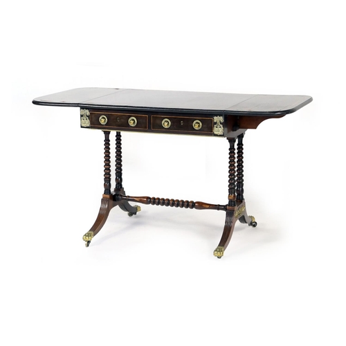 578 - Late Regency rosewood and inlaid sofa table, the top with two drop leaves with brass line inlay, ove... 