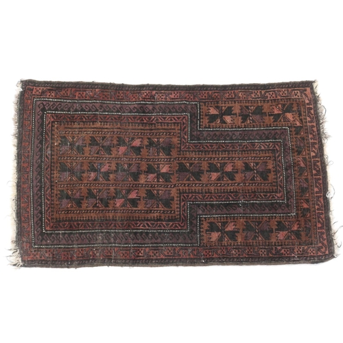 580 - Balouch prayer rug, with madder ground, size approx. 130cm x 79cm