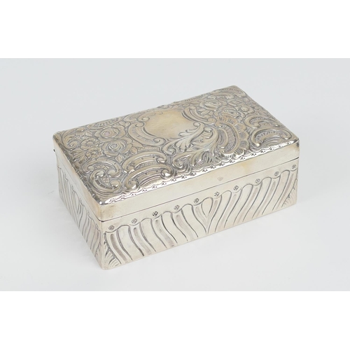 72 - Victorian silver box, London 1894, rectangular form, the cover decorated with flowers and C-scrolls ... 