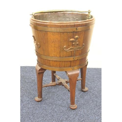 606 - Victorian mahogany coopered coal pail on stand, with brass swing handle and liner, brass banding wit... 