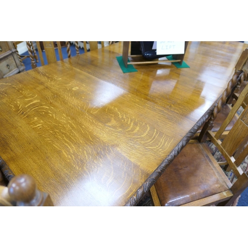 589 - Victorian carved oak extending dining table, and a set of twelve oak barleytwist dining chairs, the ... 