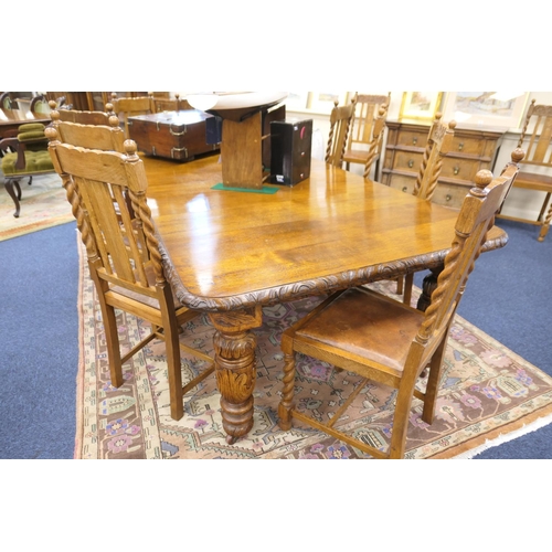 589 - Victorian carved oak extending dining table, and a set of twelve oak barleytwist dining chairs, the ... 