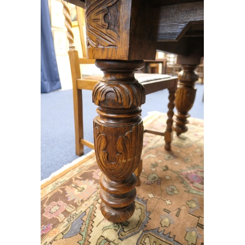 589 - Victorian carved oak extending dining table, and a set of twelve oak barleytwist dining chairs, the ... 