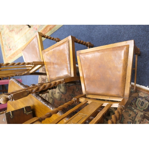 589 - Victorian carved oak extending dining table, and a set of twelve oak barleytwist dining chairs, the ... 