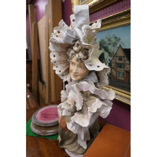 43 - Royal Dux bust of a Belle Epoque young lady in elaborately frilled costume, decorated in coloured gl... 