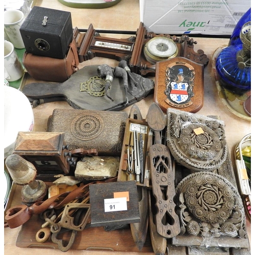 91 - Assorted treen including modern Welsh love spoons, desk calendar, bellows, barometer, box camera etc