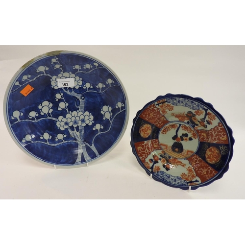 162 - Japanese blue and white prunus patterned plate and a Japanese Imari patterned plate (2)