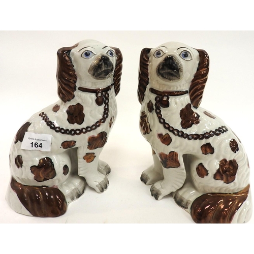 164 - Pair of Victorian copper lustre spaniels