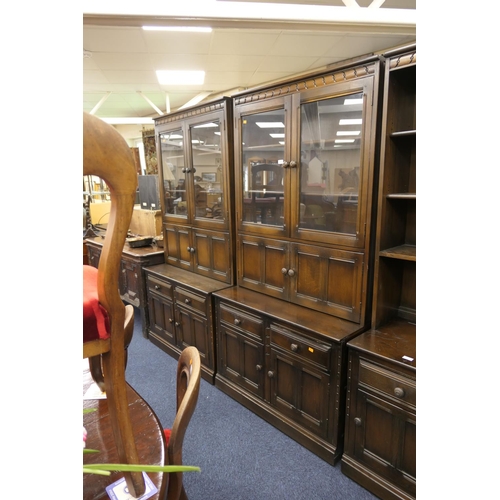 442 - Pair of Ercol dark stained oak and elm lounge display cabinets