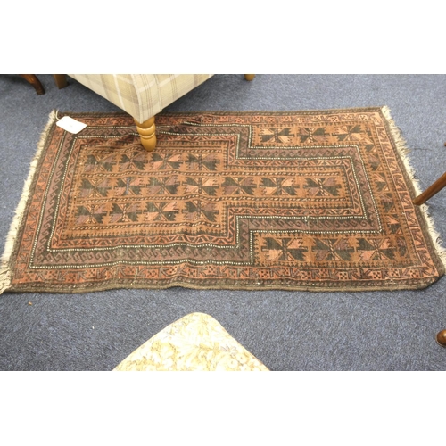 524 - Balouch prayer rug, with madder ground, size approx. 130cm x 79cm