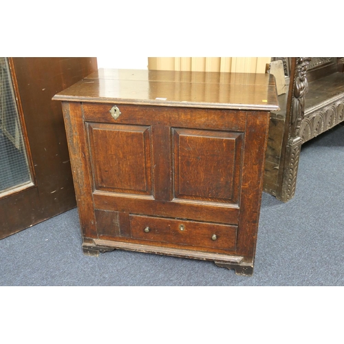 593 - Oak blanket box with two panelled front fitted with a drawer, width 82.5cm