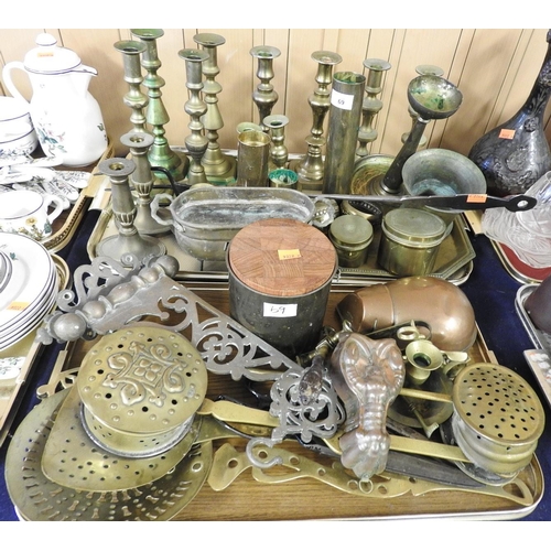 69 - Assorted metal wares including six pairs of brass candlesticks, brass lidded pots, wrought steel toa... 