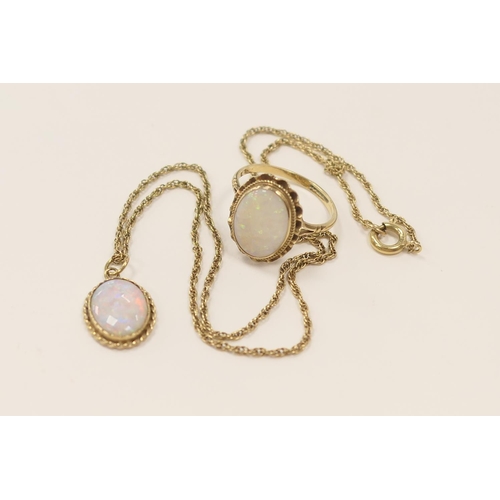 313 - Opal dress ring in 9ct gold, ring size P; also similar opal pendant necklace in 9ct gold (2)