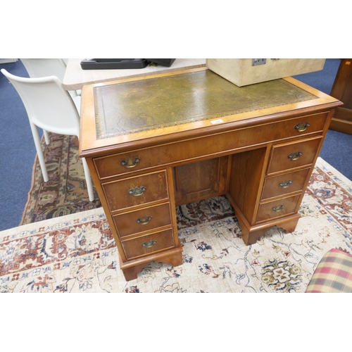 559 - Walnut kneehole desk with leather inset top