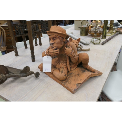 571 - Amusing terracotta figural ridge tile, modelled as a shepherd calling his dog, 41cm x 39m