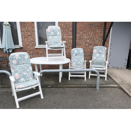 538 - White plastic garden suite comprising oval table and four folding armchairs