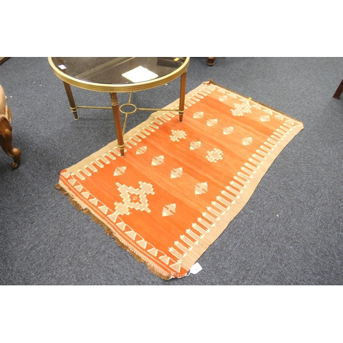 599 - Kilim red ground woollen rug, 136cm x 80cm