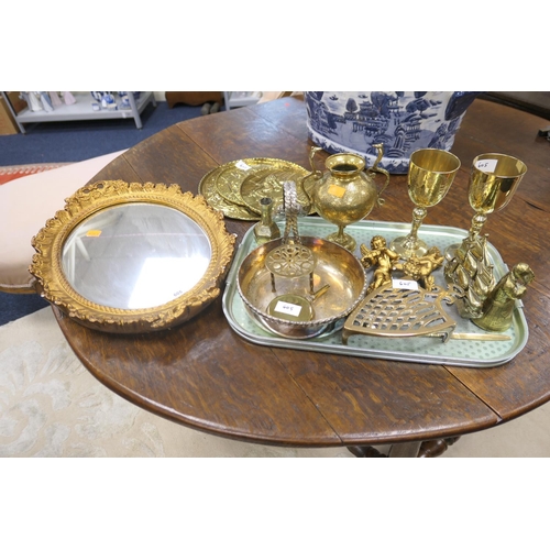 605 - Decorative gilt plaster oval wall mirror, assorted brass and other metal wares including Indian pede... 