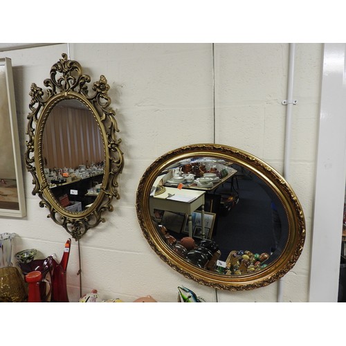 76 - Oval moulded gilt framed wall mirror and further oval gilt framed bevelled edged wall mirror (2)