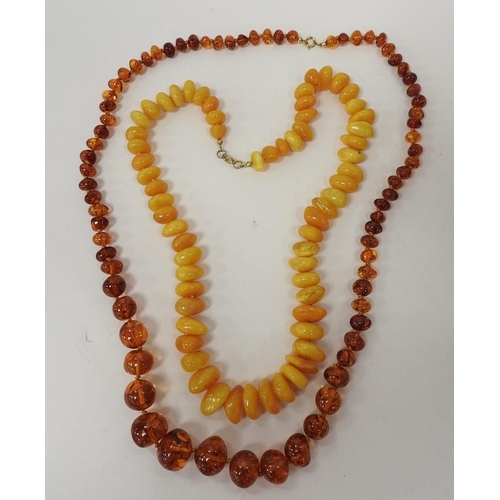 299 - Butterscotch amber pebble necklace, weight including the clasp approx. 60g; also a Baltic amber bead... 