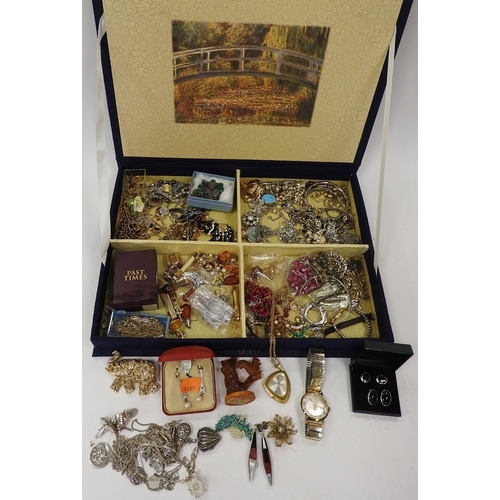 315 - Blue fabric jewellery box containing an assortment of costume jewellery including some silver; also ... 