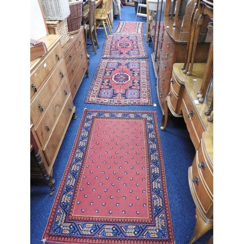 439 - Pair of Eastern red and blue ground woollen rugs, size 150cm x 93cm, further smaller woollen rug, si... 