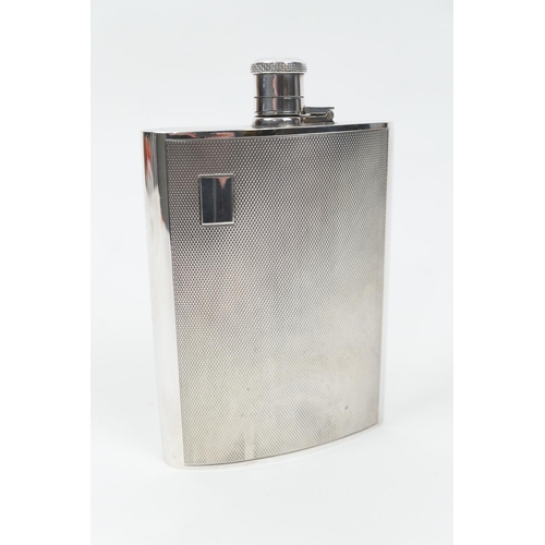 100 - Silver hip flask, Birmingham 1989, of curved form with bayonet hinged cap, engine turned decoration ... 