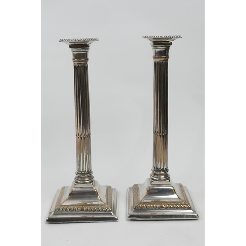 195 - Pair of late George III old Sheffield plated candlesticks, circa 1800 (loaded), height 28.5cm