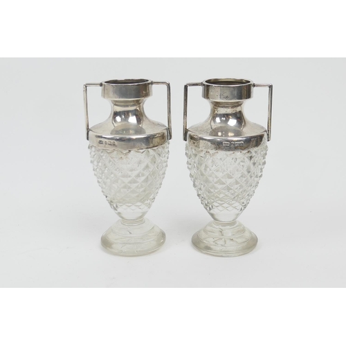 208 - Pair of silver mounted cut glass bud vases, Birmingham 1901, twin handles and strawberry cut ovoid b... 