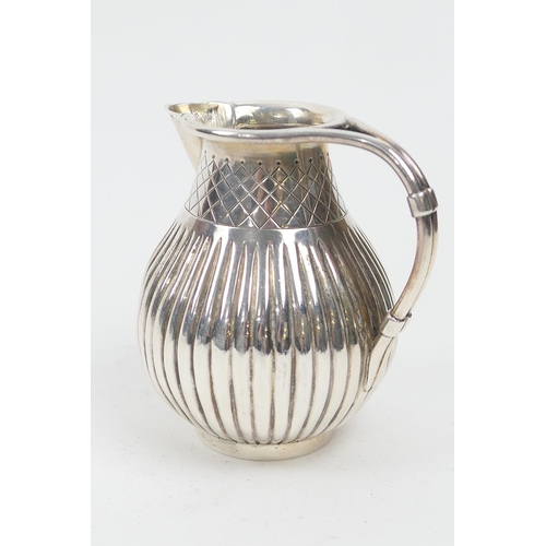 214 - Victorian silver thistle form cream jug, London 1865, reeded baluster form, height 8.5cm, weight app... 