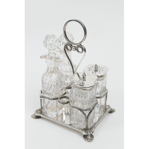 219 - Victorian silver cruet, maker HA, Sheffield 1898, supporting four cut glass bottles, two with silver... 