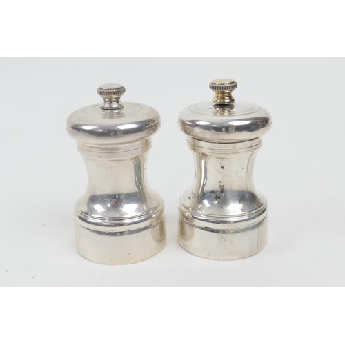 221 - Two modern silver pepper mills, Birmingham 2000, height 8cm