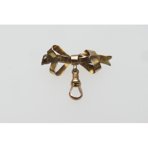 393 - 9ct gold bow brooch, with spring clip, for use with a fob watch, gross weight approx. 2.5g