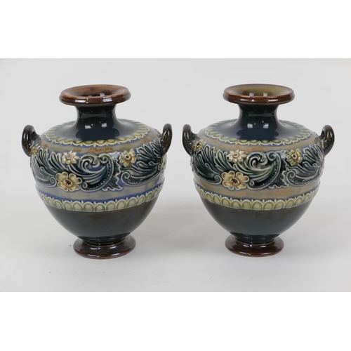53 - Pair of Doulton Lambeth stoneware small vases, of squat amphora shape with twin handles and decorate... 