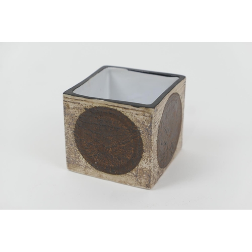 57 - Troika cube vase, decorated with four brown discs in a textured finish against a buff brown ground, ... 