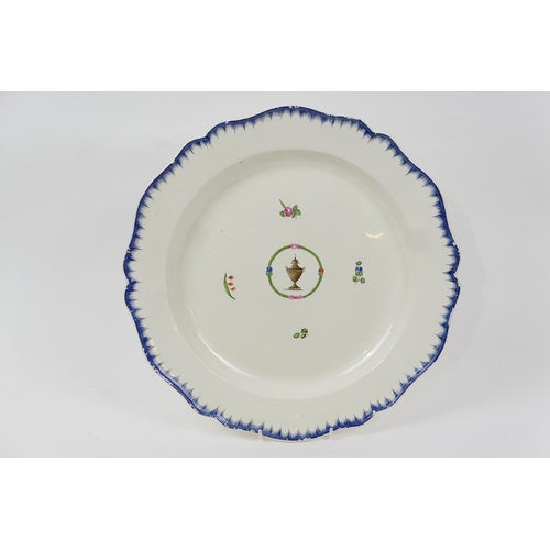 62 - Leeds creamware platter, circa 1790, the centre decorated with an urn and with floral sprigs, within... 