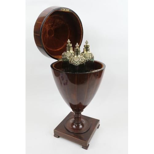 697 - George III mahogany and inlaid urn shaped knife box converted to a decanter box, containing three gr... 