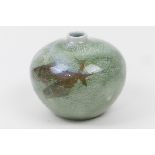 72 - Royal Doulton small art vase, globular form decorated with sea fishes against a mottled green and sp... 