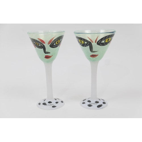 79 - Pair of Kosta Boda hand decorated cocktail glasses, each painted with a Picassoesque face, signed by... 