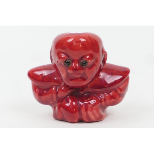 86 - Bernard Moore red flambe Diakokan figure, set with original glass eyes, painted initials 'BM' and im... 