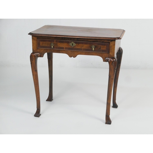 884 - Walnut side table, 18th Century with later restoration, the rectangular top with kick-in corners and... 