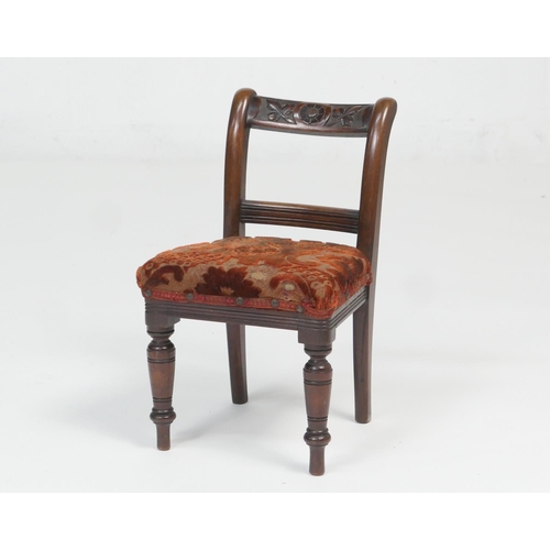 890 - Victorian carved mahogany child's chair, the top rail carved and centred with a flower, with figured... 