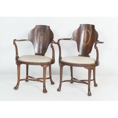 898 - Two mahogany and inlaid bow back armchairs, circa 1900, the backs of vase shape inlaid with boxwood ... 