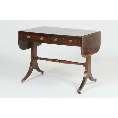 901 - Late Regency mahogany sofa table, circa 1820, the crossbanded top with drop leaves over two frieze d... 